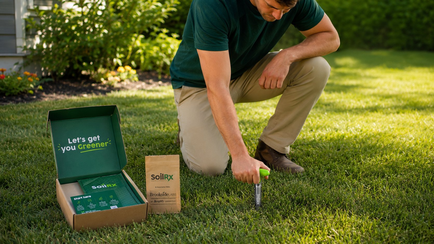 A man using the Lammas core probe to take a soil sample from his lawn, kit open beside him